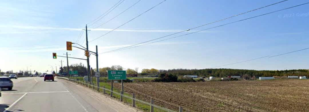 Roadside view showing existing aerial hydro lines along Brock Road South.